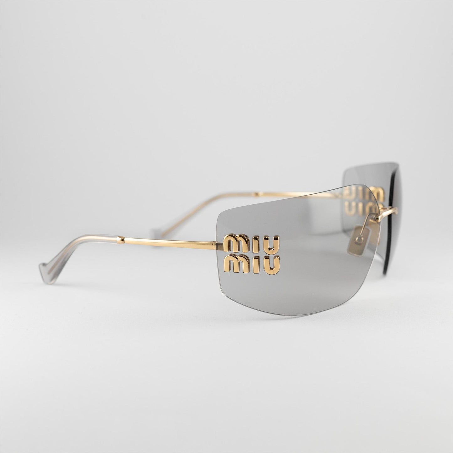 Occhiale da sole Miu Miu SMU 54YS 5AK-30B Grey - lato - Shop Ottica Mineo