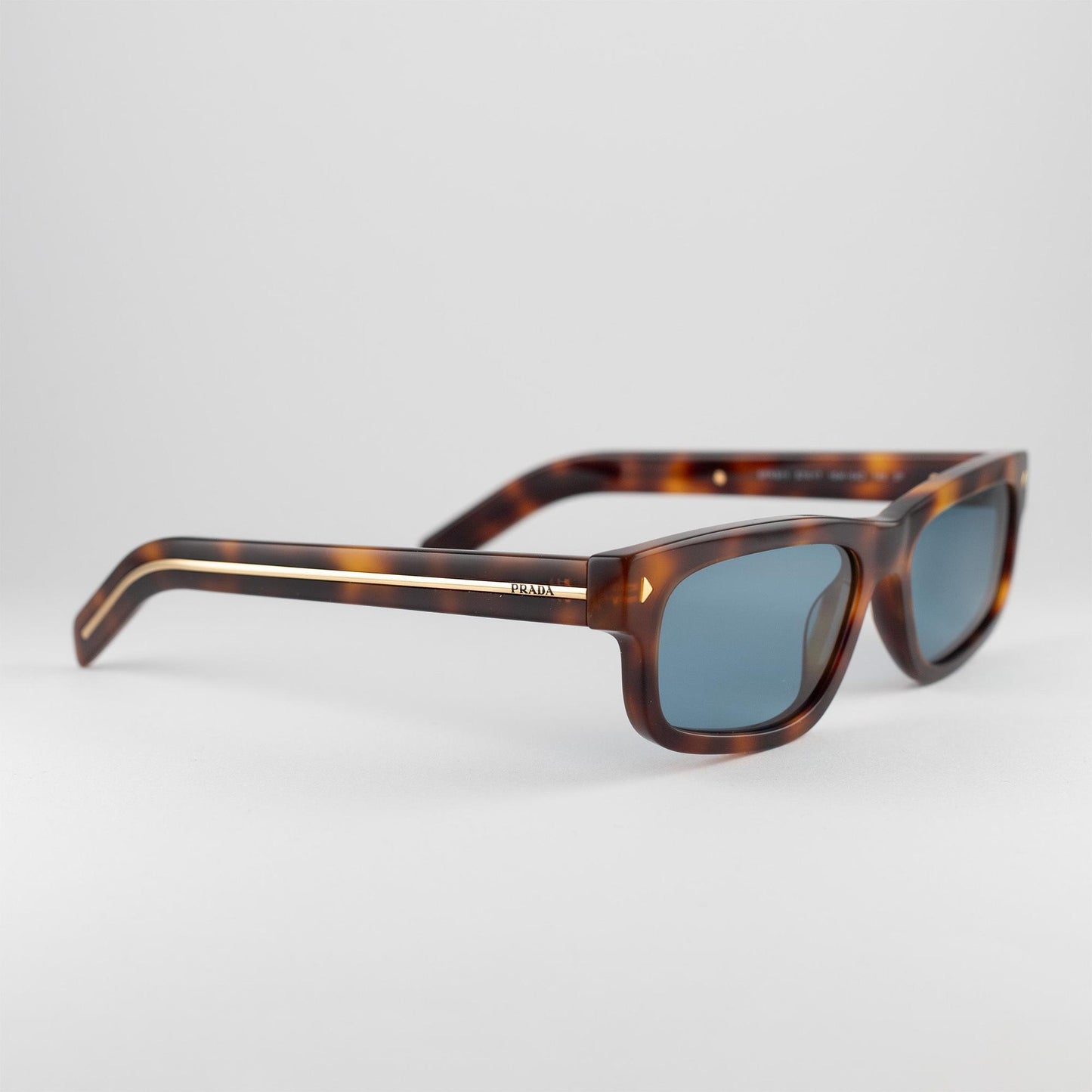 Occhiale da sole Prada SPR B11 15W/04D Havana - lato - Shop Ottica Mineo