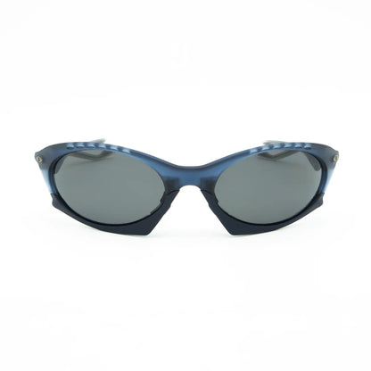 Occhiale da sole Oakley Plantaris OO9437 943709 Blu trasparente opaco - Shop Ottica Mineo